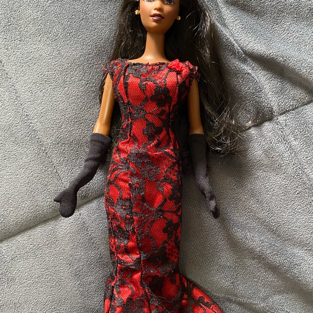 Barbie doll with red and black dress